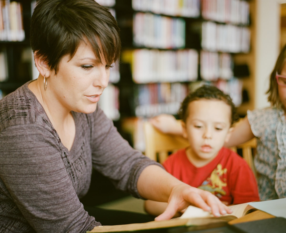 Tutor going through a lesson one to one with a student